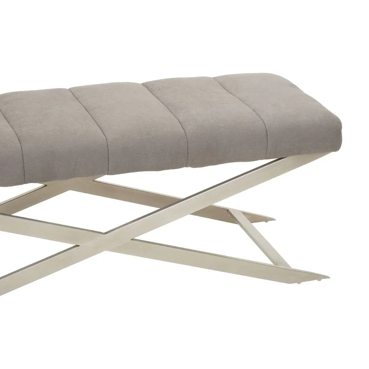 Beige fabric bench with metal X-frame legs and panelled cushioned seat, side angle view