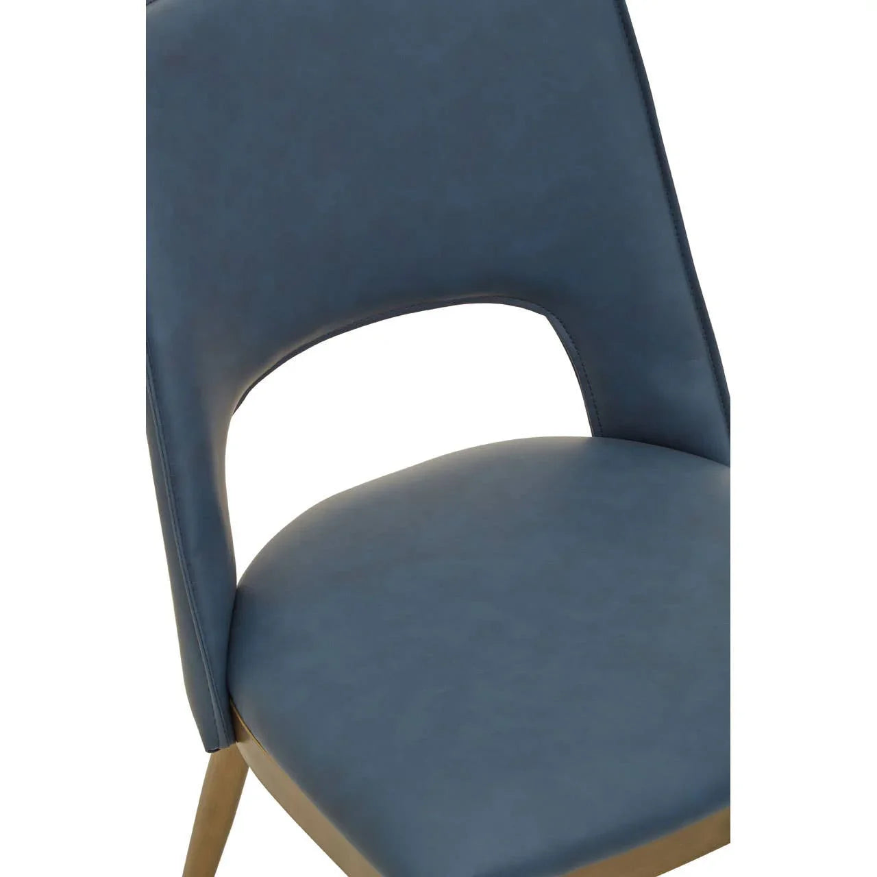 Blue faux leather dining chair with cut-out backrest and light wood legs, close-up view