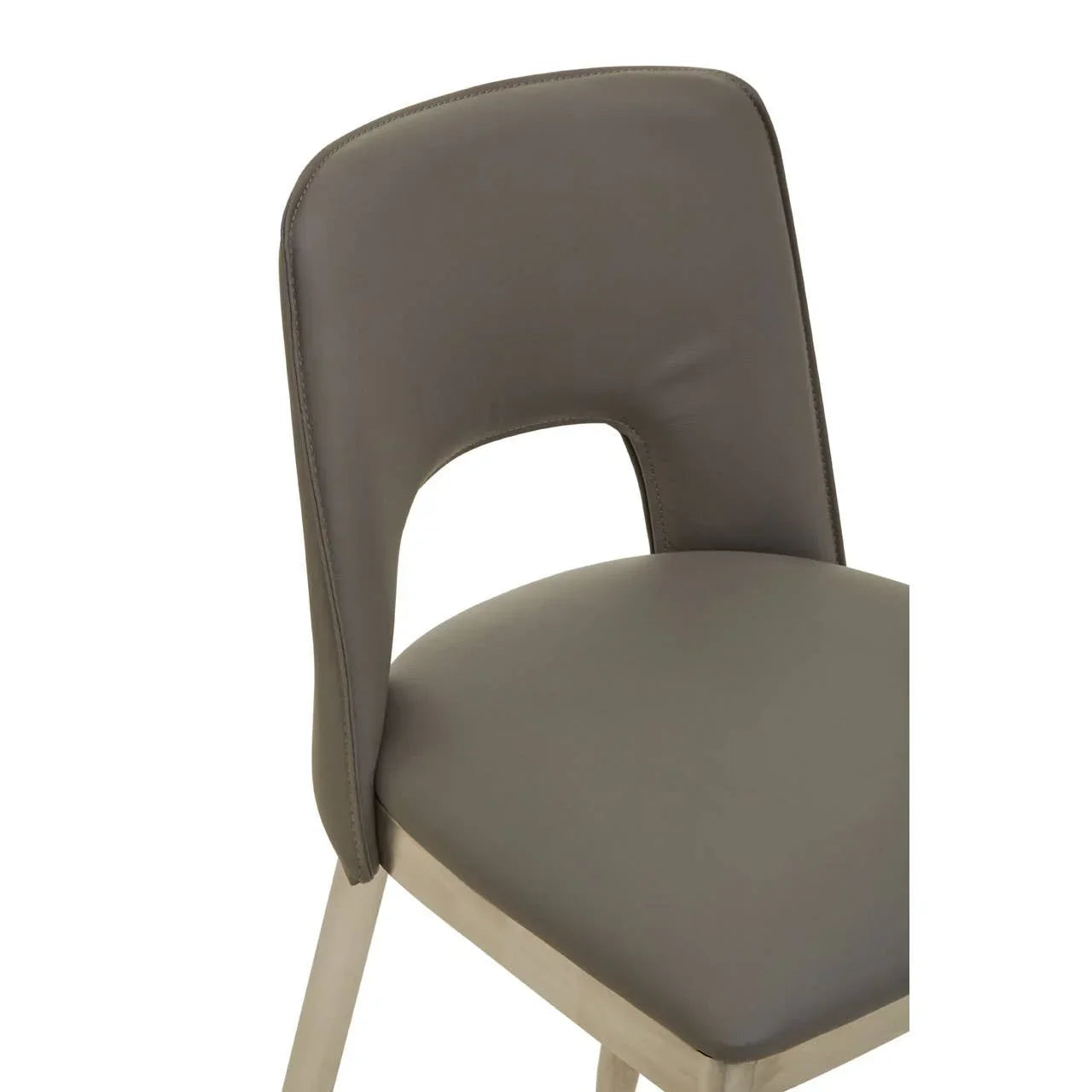 Grey faux leather dining chair with curved backrest and metal legs close-up