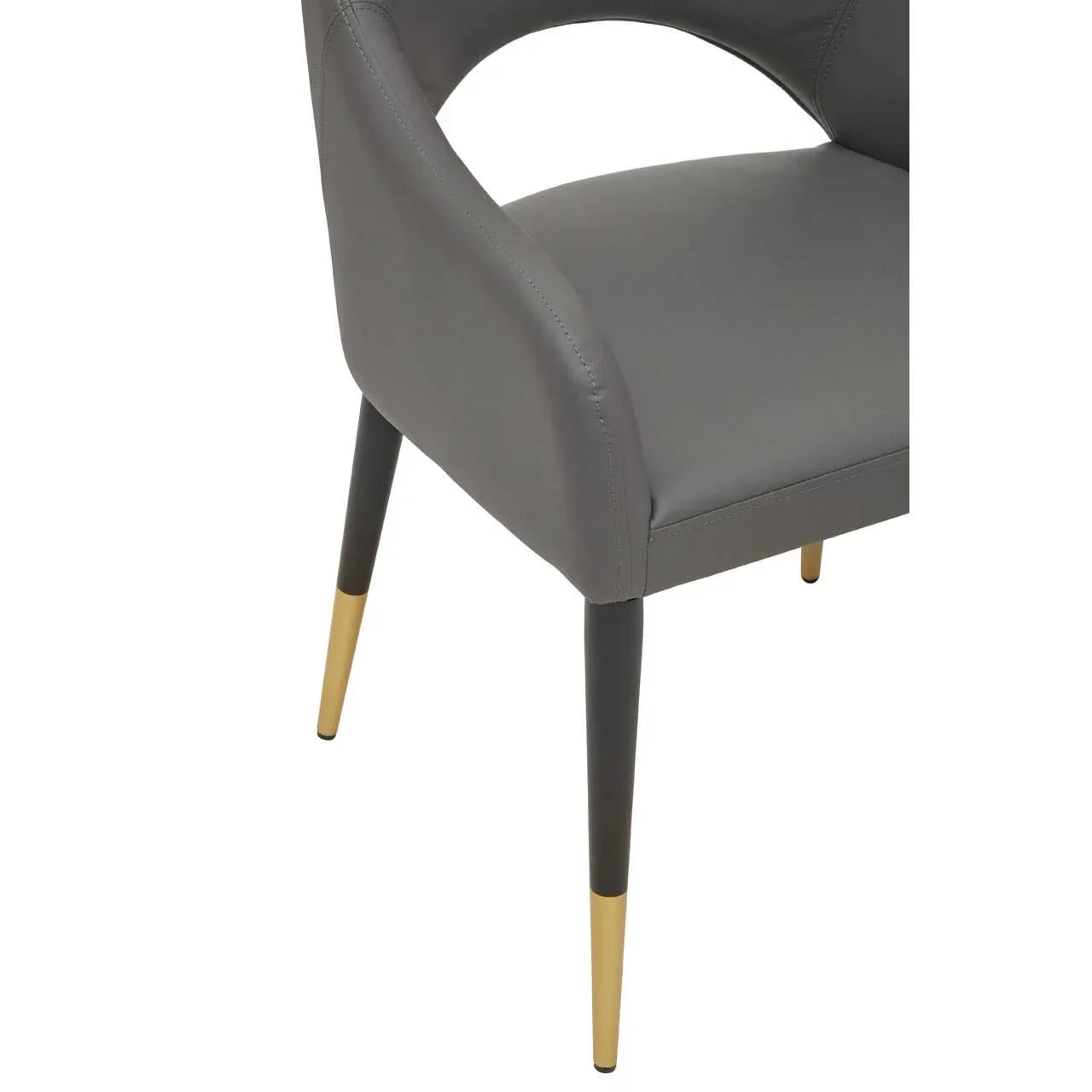 Grey dining chair with curved backrest and black legs featuring gold metal tips