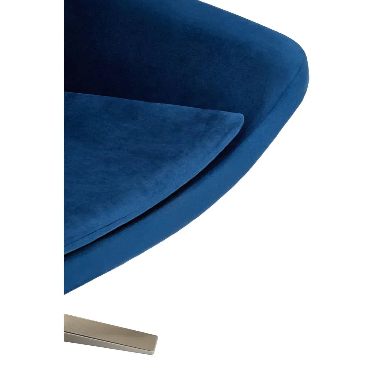 Blue velvet chair seat closeup with metal leg corner view