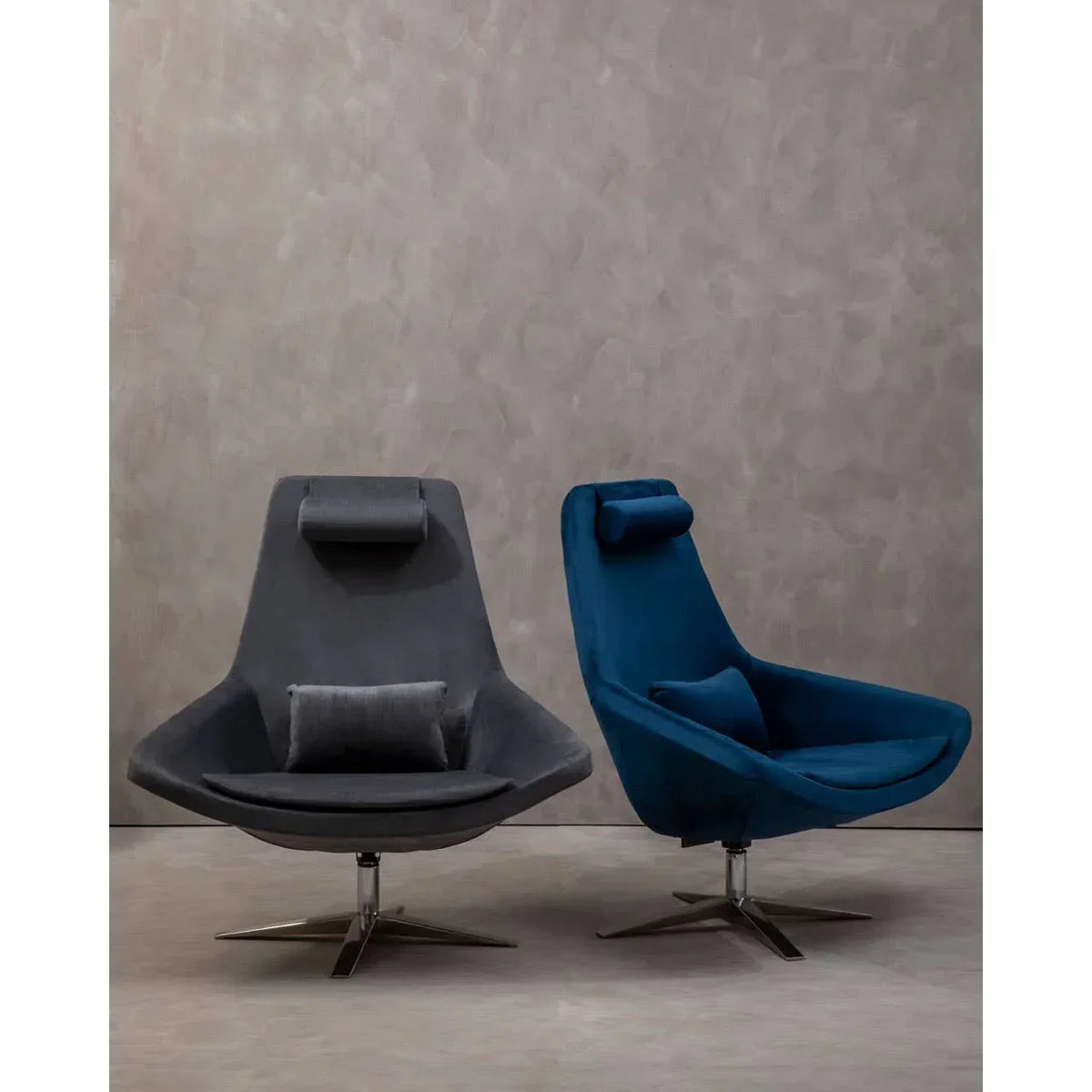 Modern swivel accent chairs in grey and blue velvet with headrests and metal bases