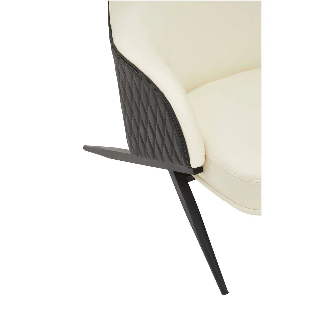 Cream upholstered dining chair with black quilted backrest and angled metal leg