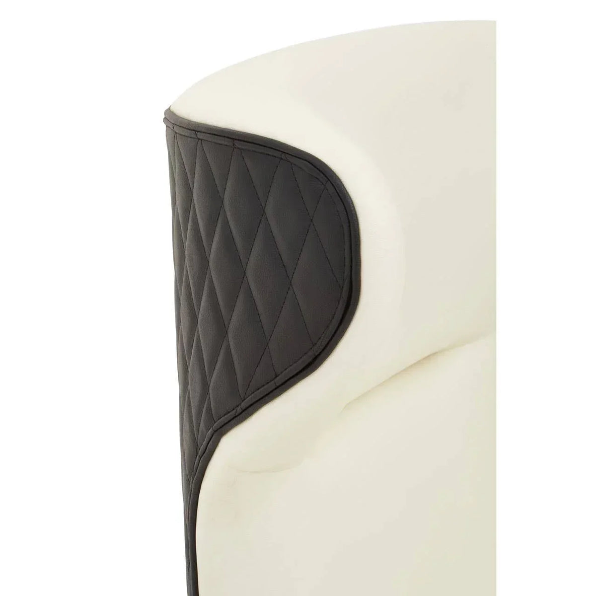 Closeup of cream chair with diamond-stitched black leather backrest panel