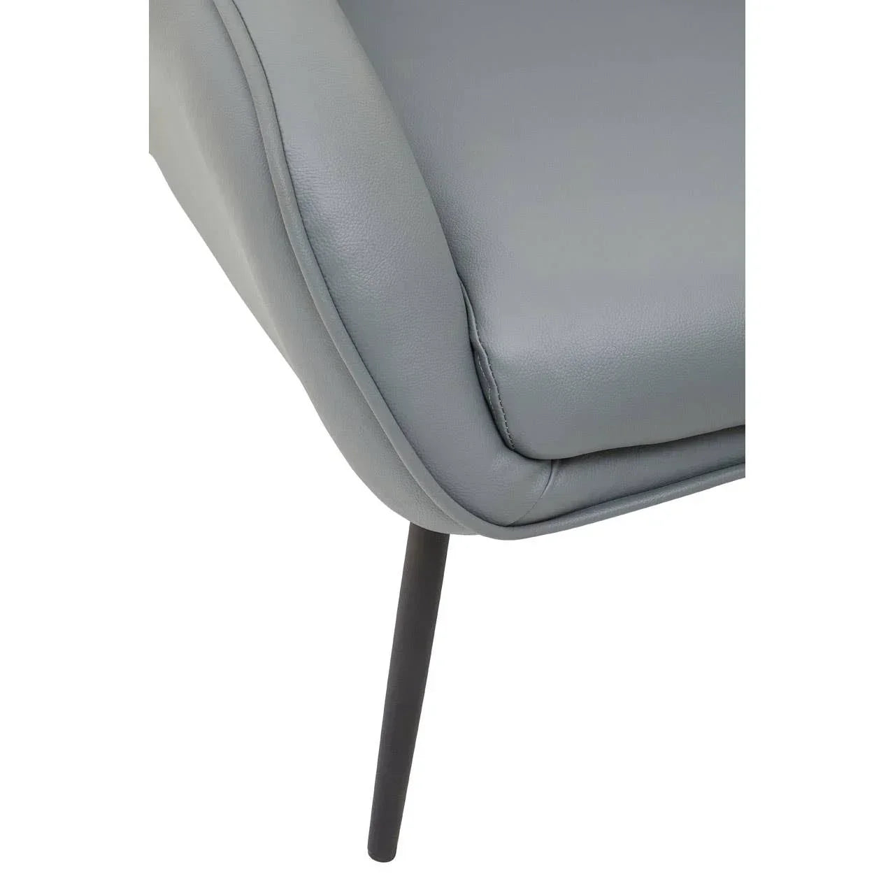 Grey faux leather dining chair seat with slim black metal leg closeup