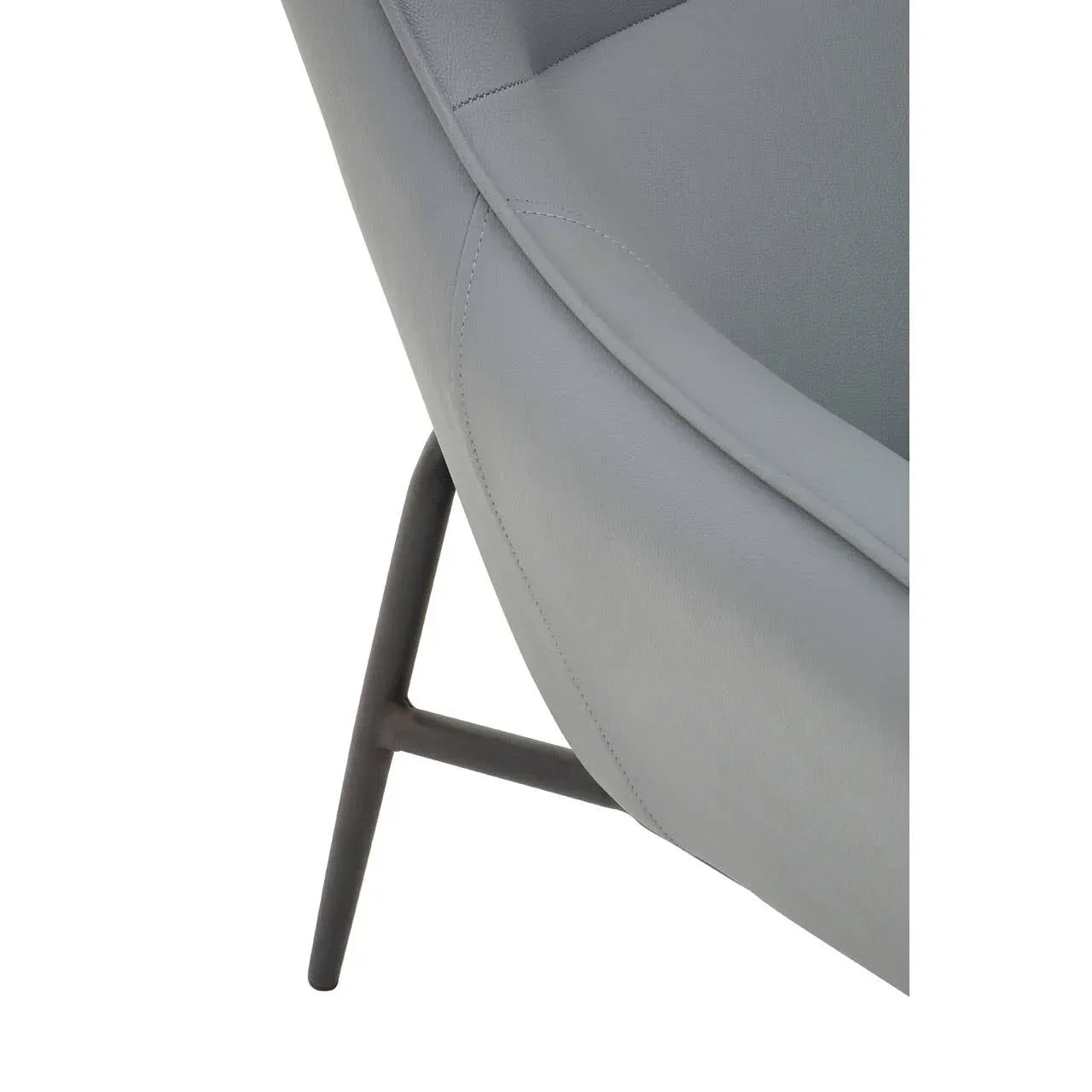 Close-up of grey upholstered chair seat with black metal leg detail