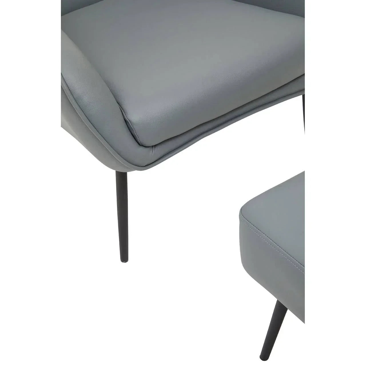 Close-up of grey dining chair seat with slim black legs