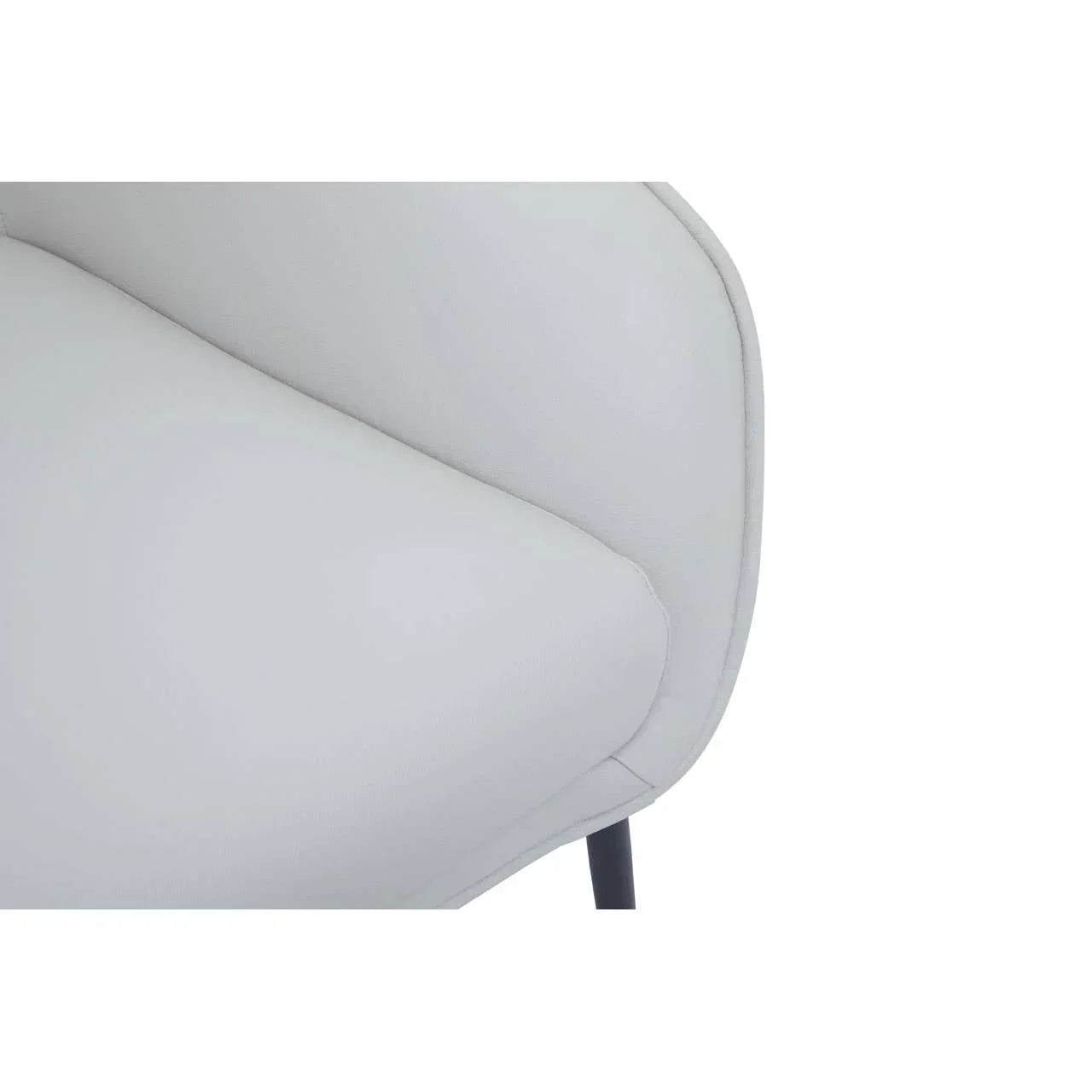 Close view of light grey sofa armrest and seat cushion with fabric texture
