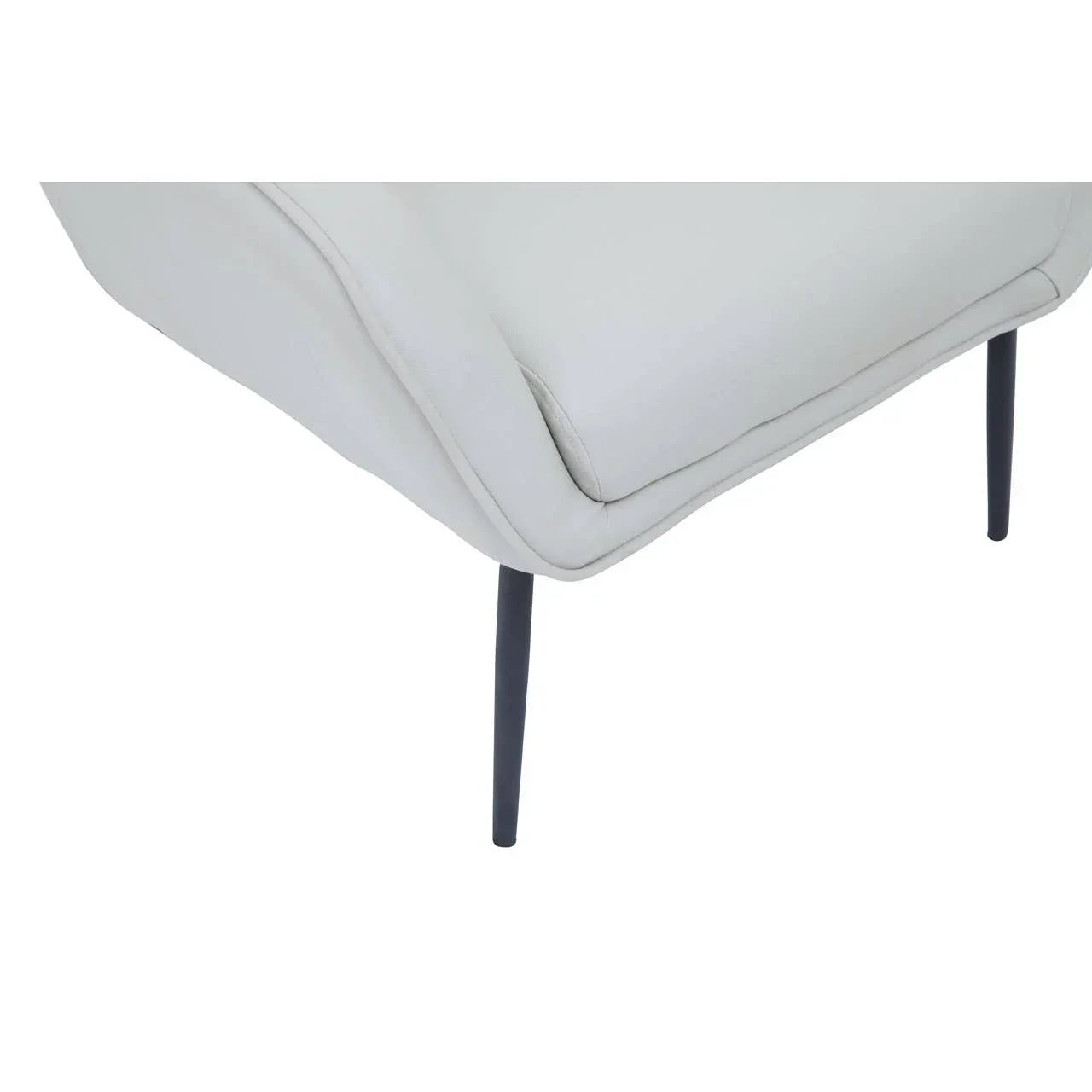 Closeup of light grey fabric sofa corner with slim black metal legs