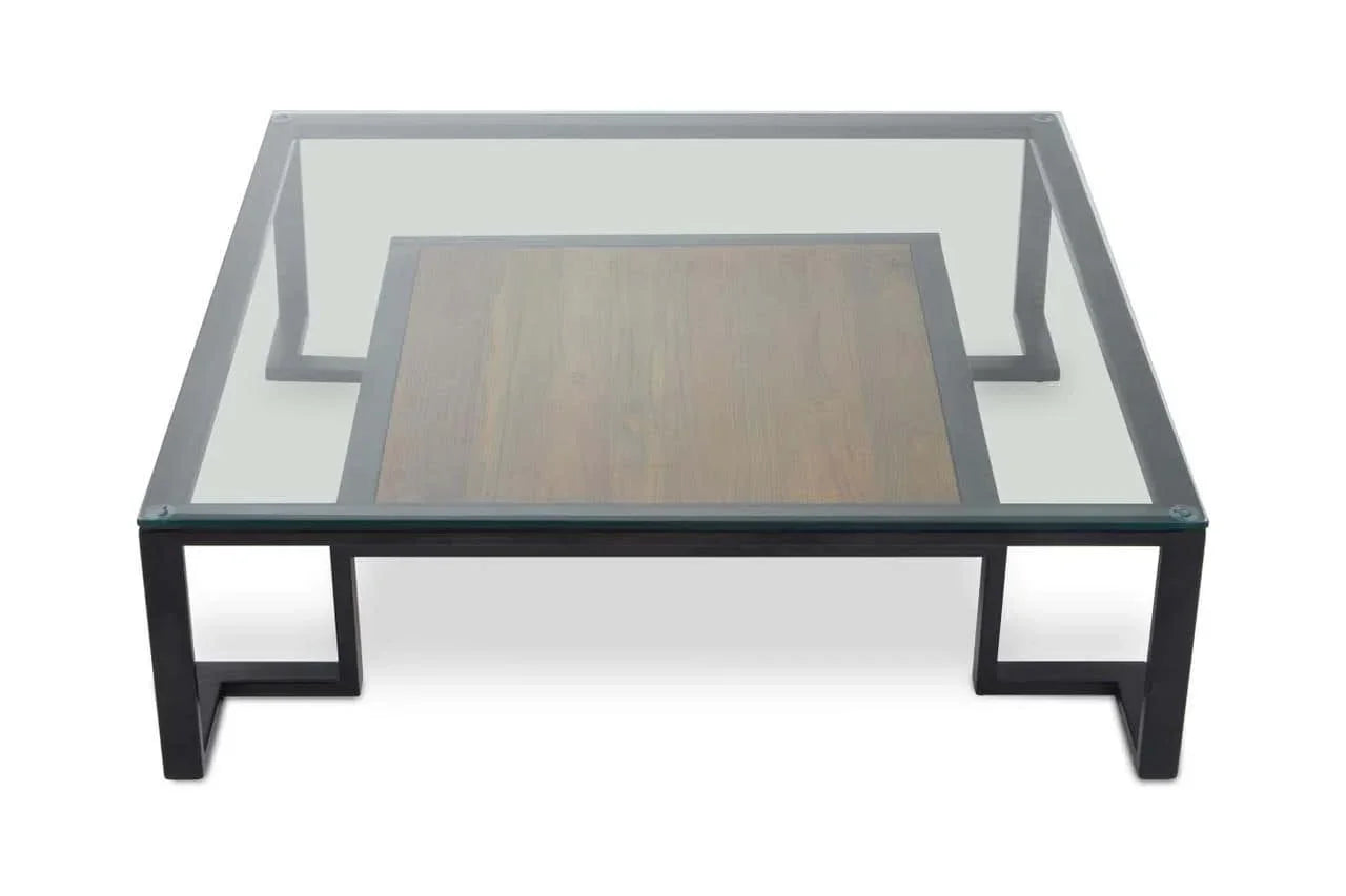 Modern coffee table with glass top, black metal frame and central wood panel, front angle