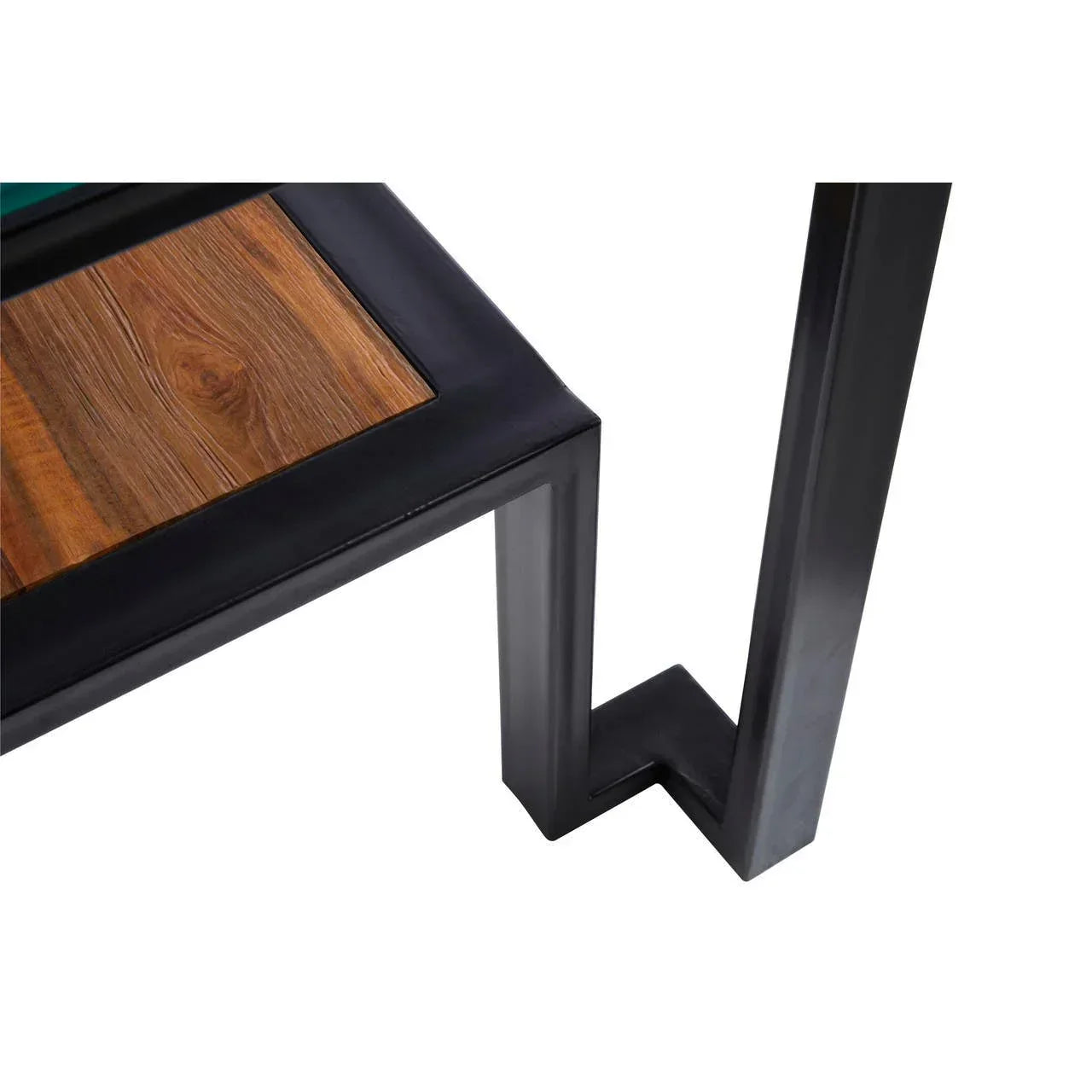 Industrial coffee table with black metal frame and wood top, close view of corner joint