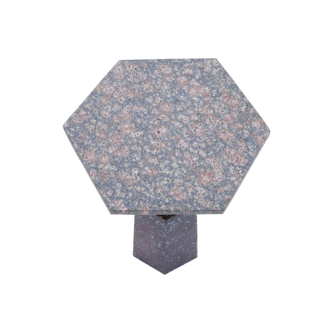 Hexagonal granite side table with speckled surface and geometric pedestal base