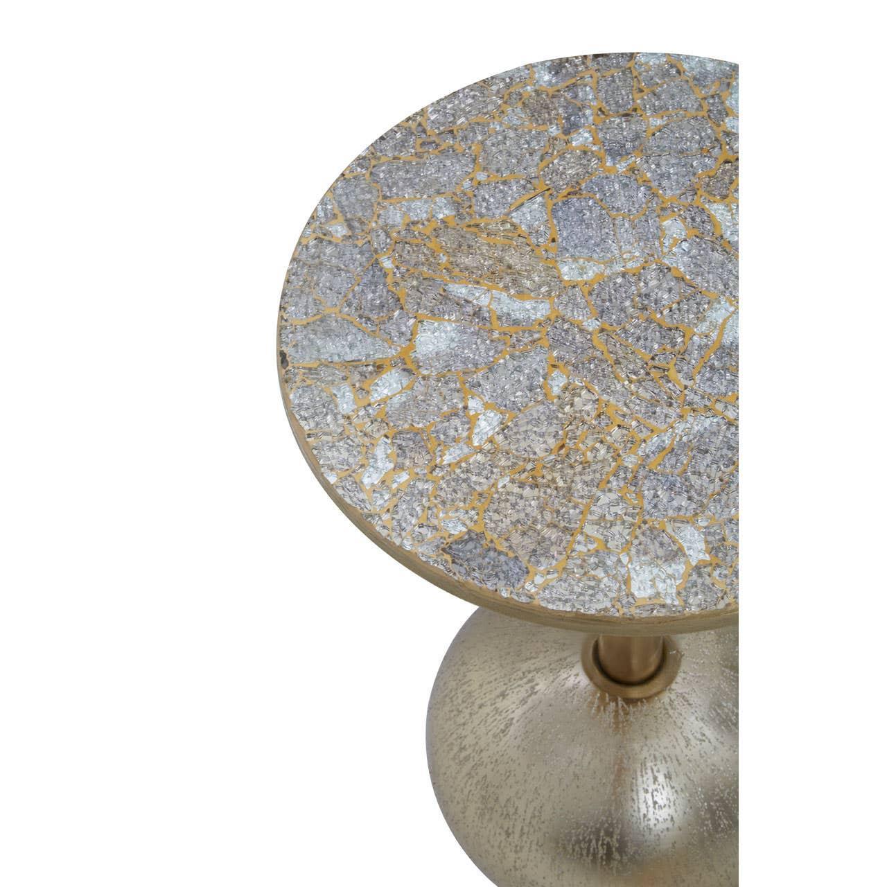 Round side table with mosaic glass top and metallic gold pedestal base, angled view