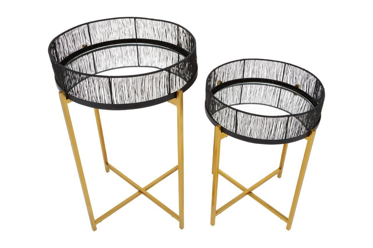 Set of two black metal tray tables with gold legs and wire detailing, side view