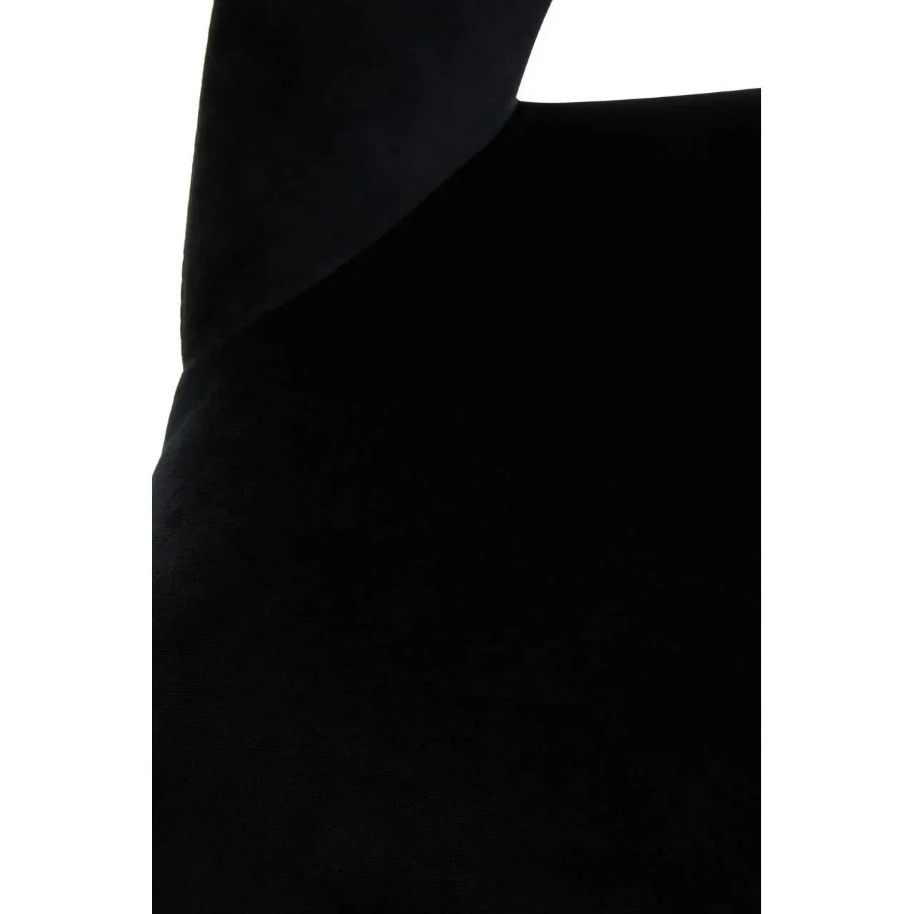 Closeup of black velvet chair upholstery showing soft fabric texture