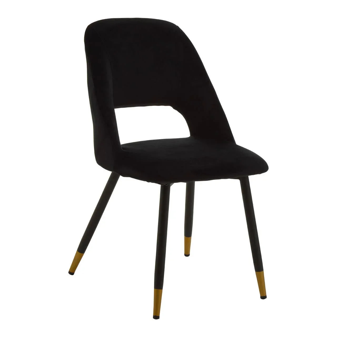 Black velvet dining chair with gold-tipped legs and cutout backrest, angled view