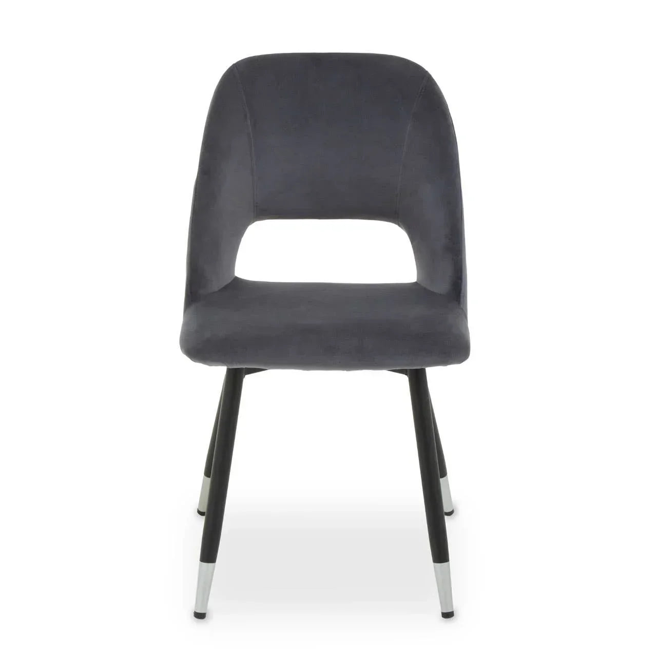 Grey velvet dining chair with open back and black metal legs, front angle view