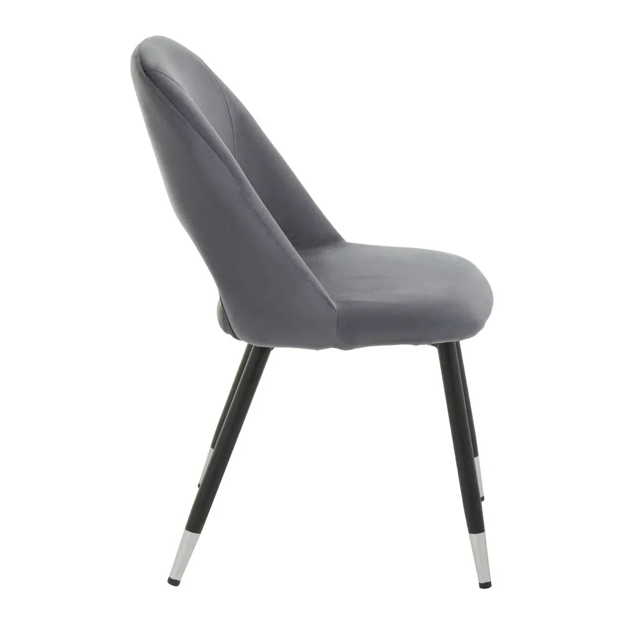 Grey velvet dining chair with black tapered legs, side view