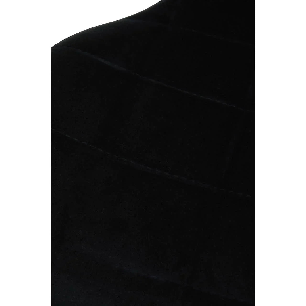 Closeup of black velvet upholstered chair backrest with subtle stitching detail