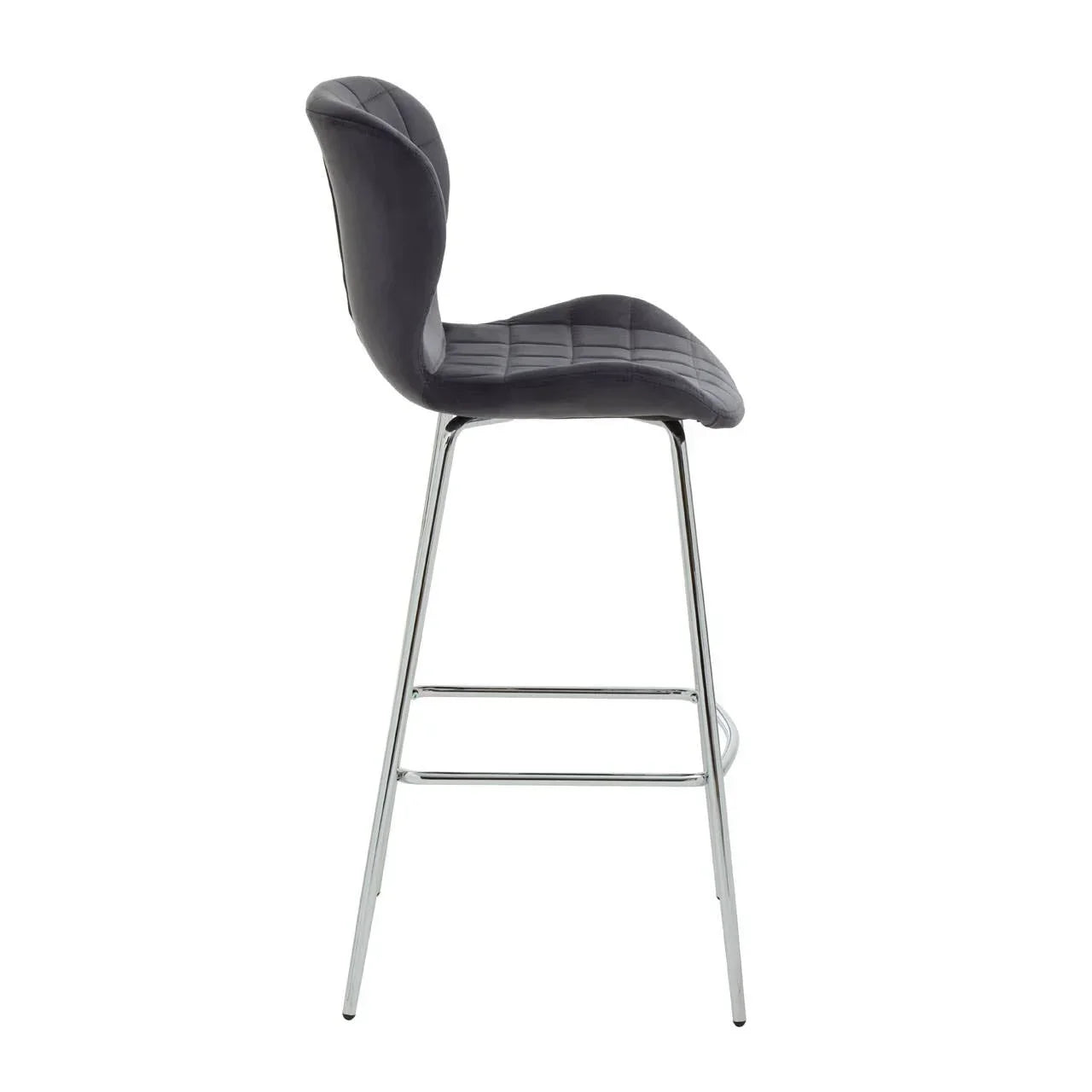 Grey bar stool with quilted seat and chrome legs, side profile view