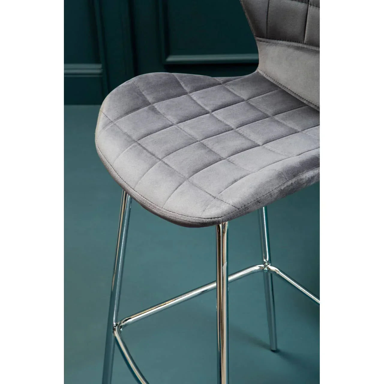 Grey velvet bar stool with quilted seat and chrome metal legs