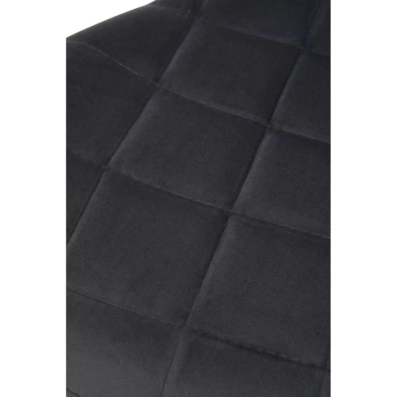 Close-up of charcoal fabric dining chair with square stitched upholstery