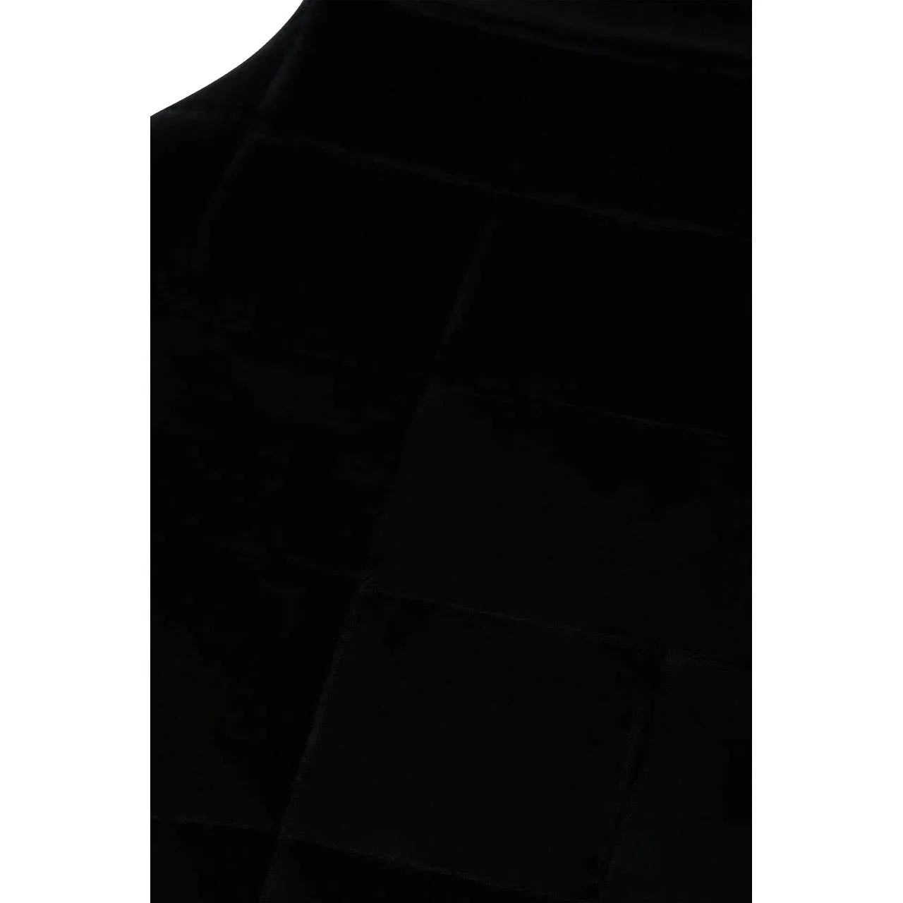 Black velvet fabric with stitched square cushion detail on furniture upholstery