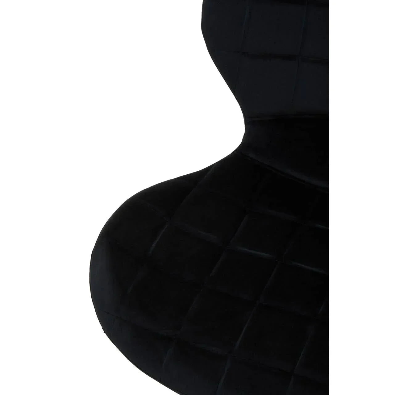 Black velvet dining chair with quilted seat and backrest close-up