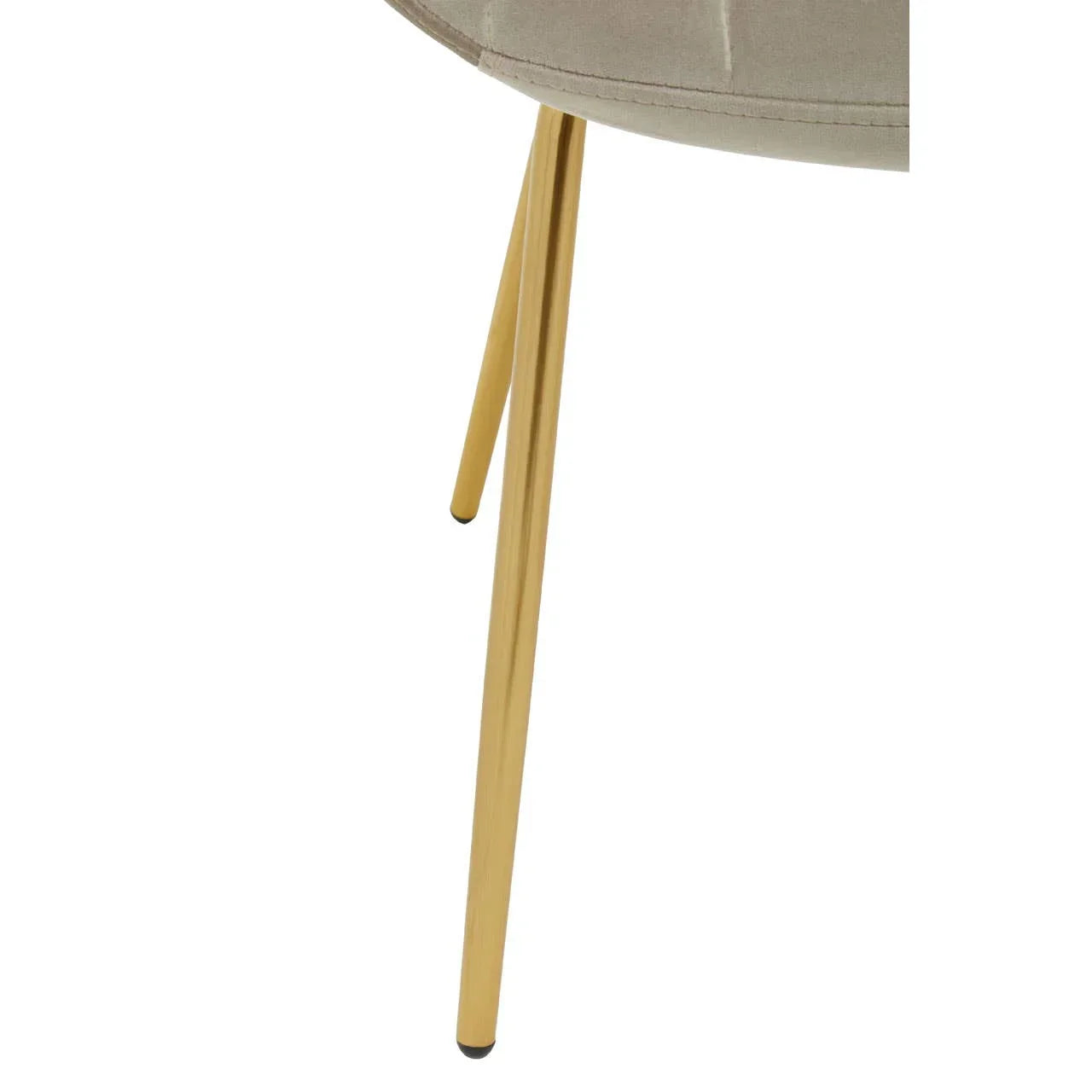 Upholstered chair with gold metal legs closeup