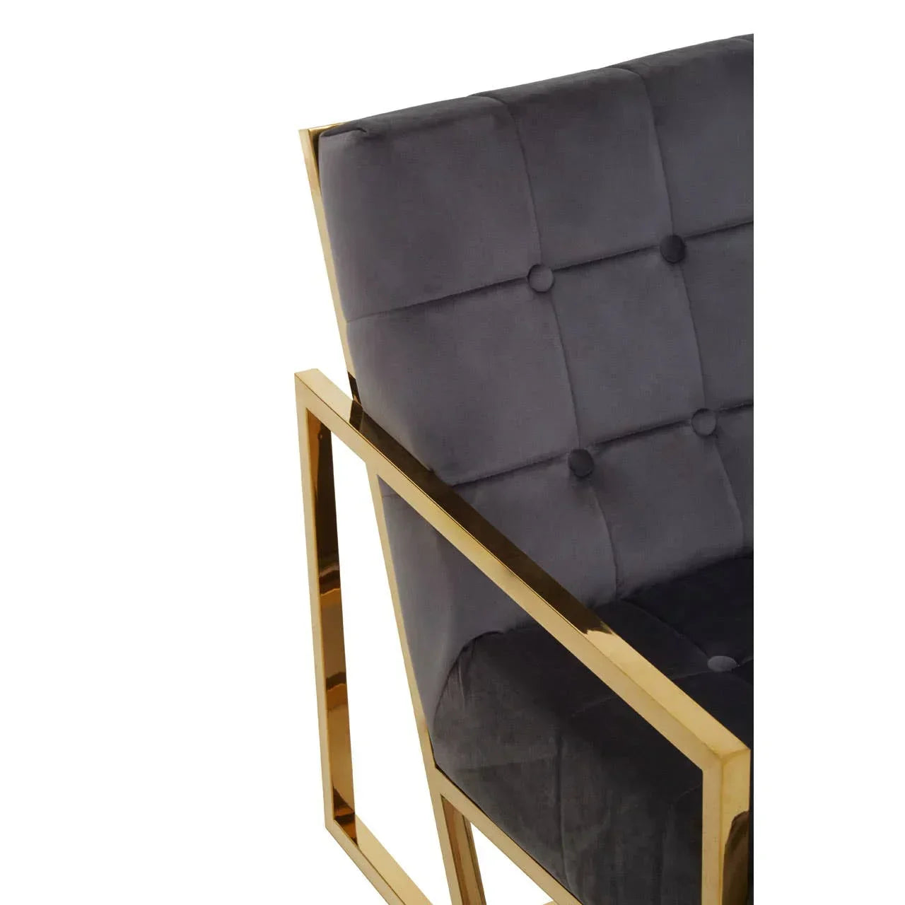 Grey velvet accent chair with gold metal frame and tufted upholstery close-up