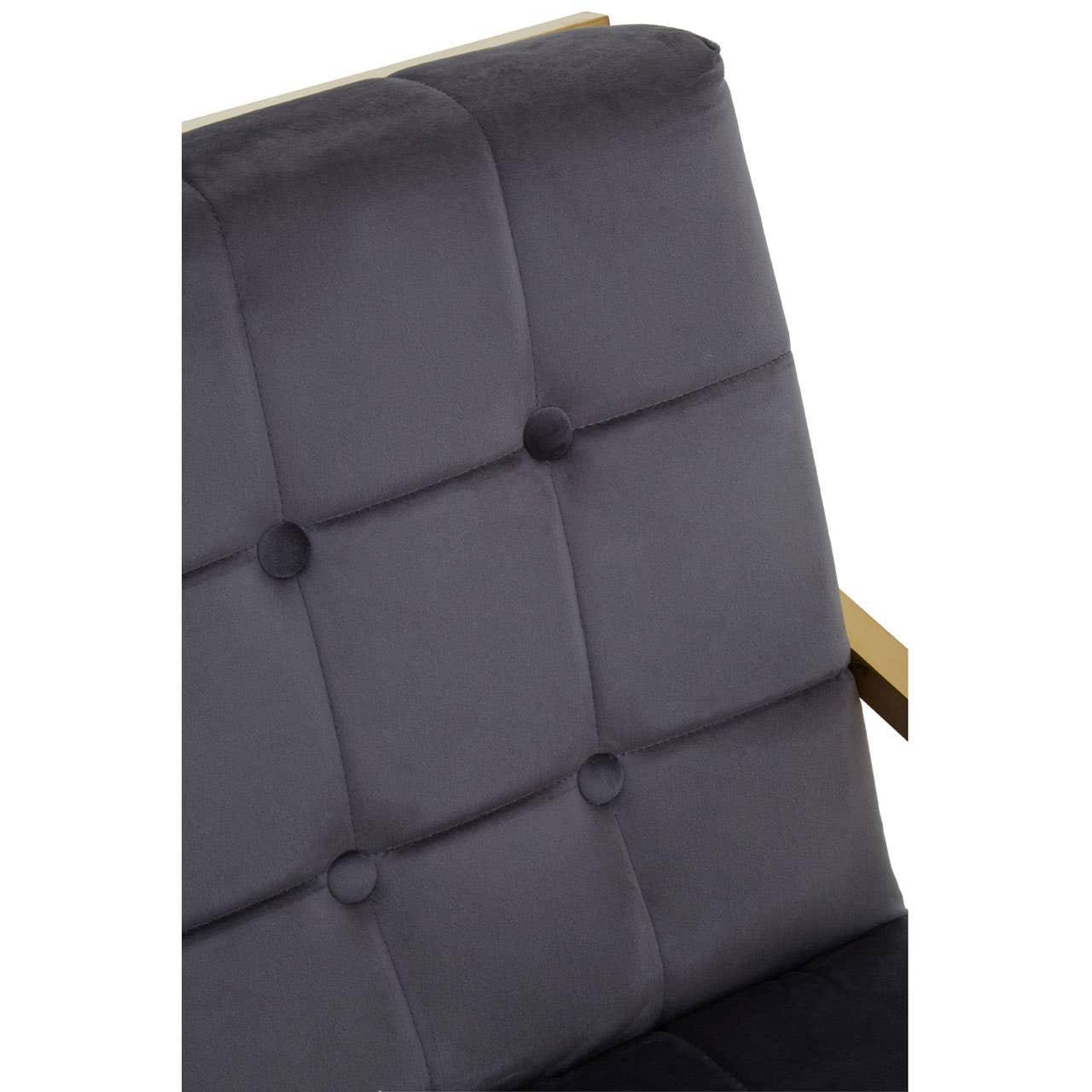 Grey velvet armchair backrest with button tufting and gold metal frame detail