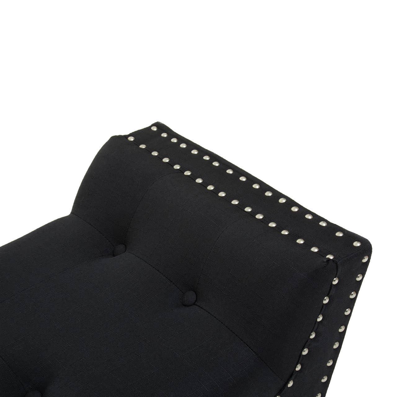 Black upholstered chair backrest with button tufting and nailhead trim detail