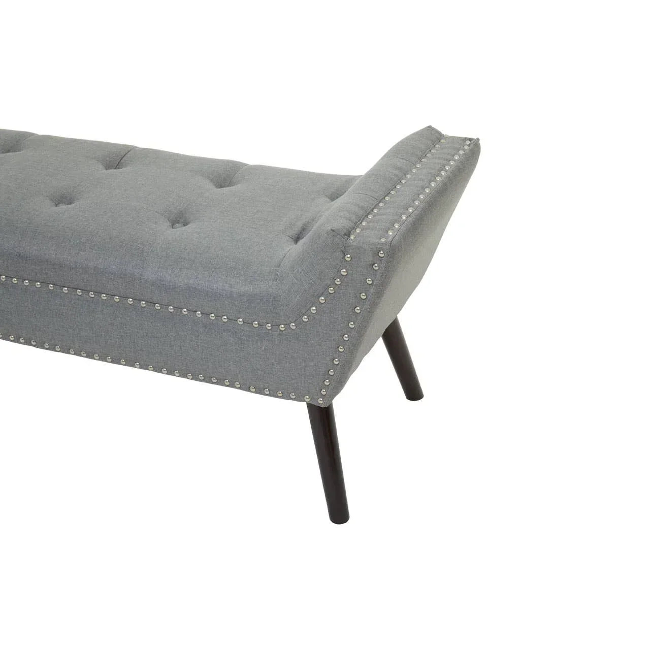 Grey upholstered bench with button tufting, studded trim and dark wooden legs