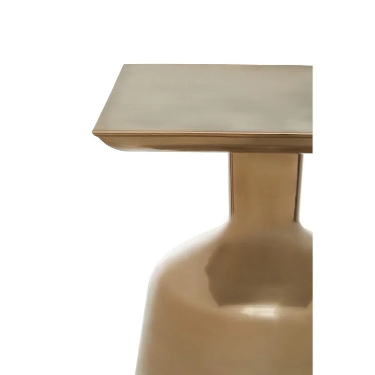 Close view of gold metal side table with square top and rounded base