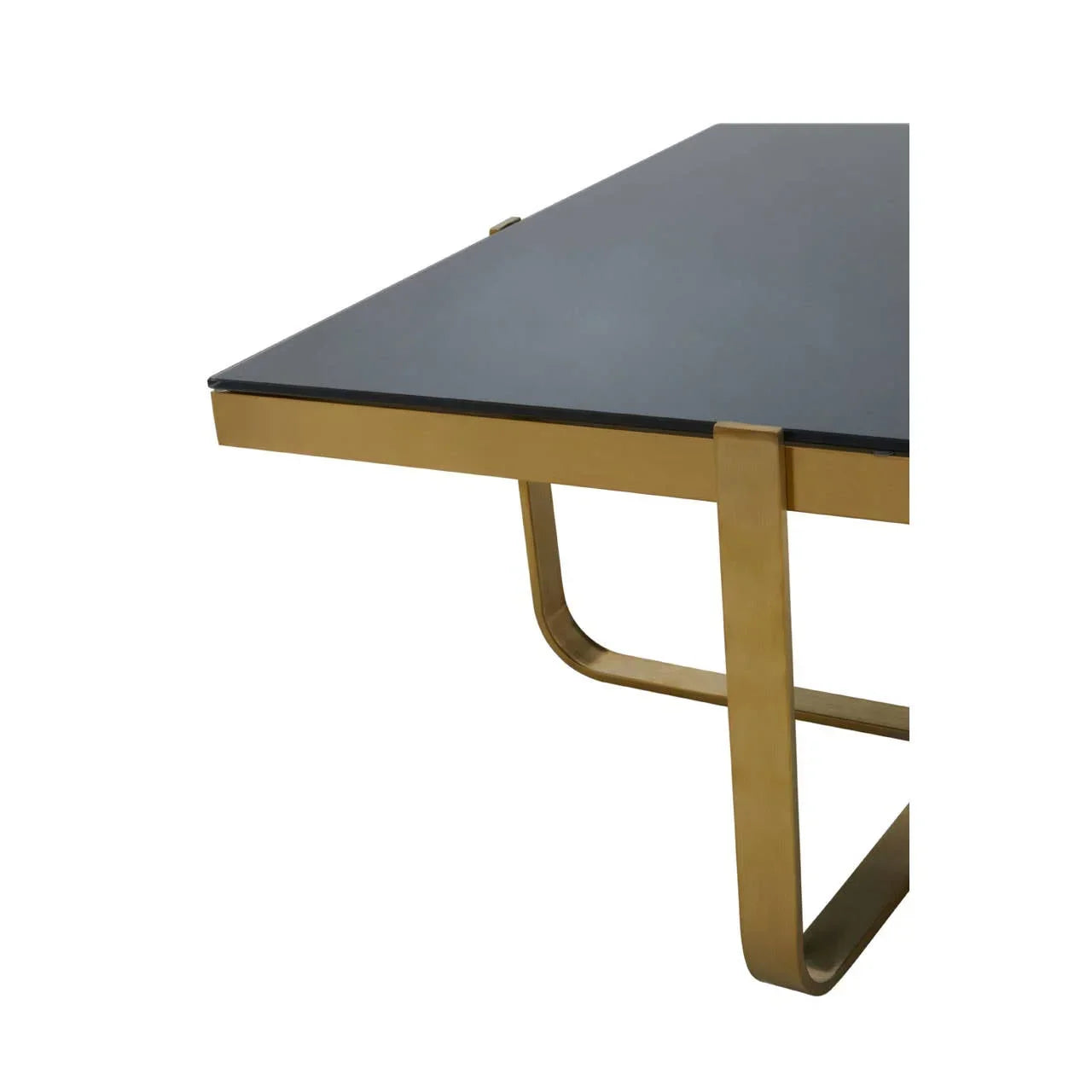Black glass dining table with gold metal frame and modern curved leg detail, side view
