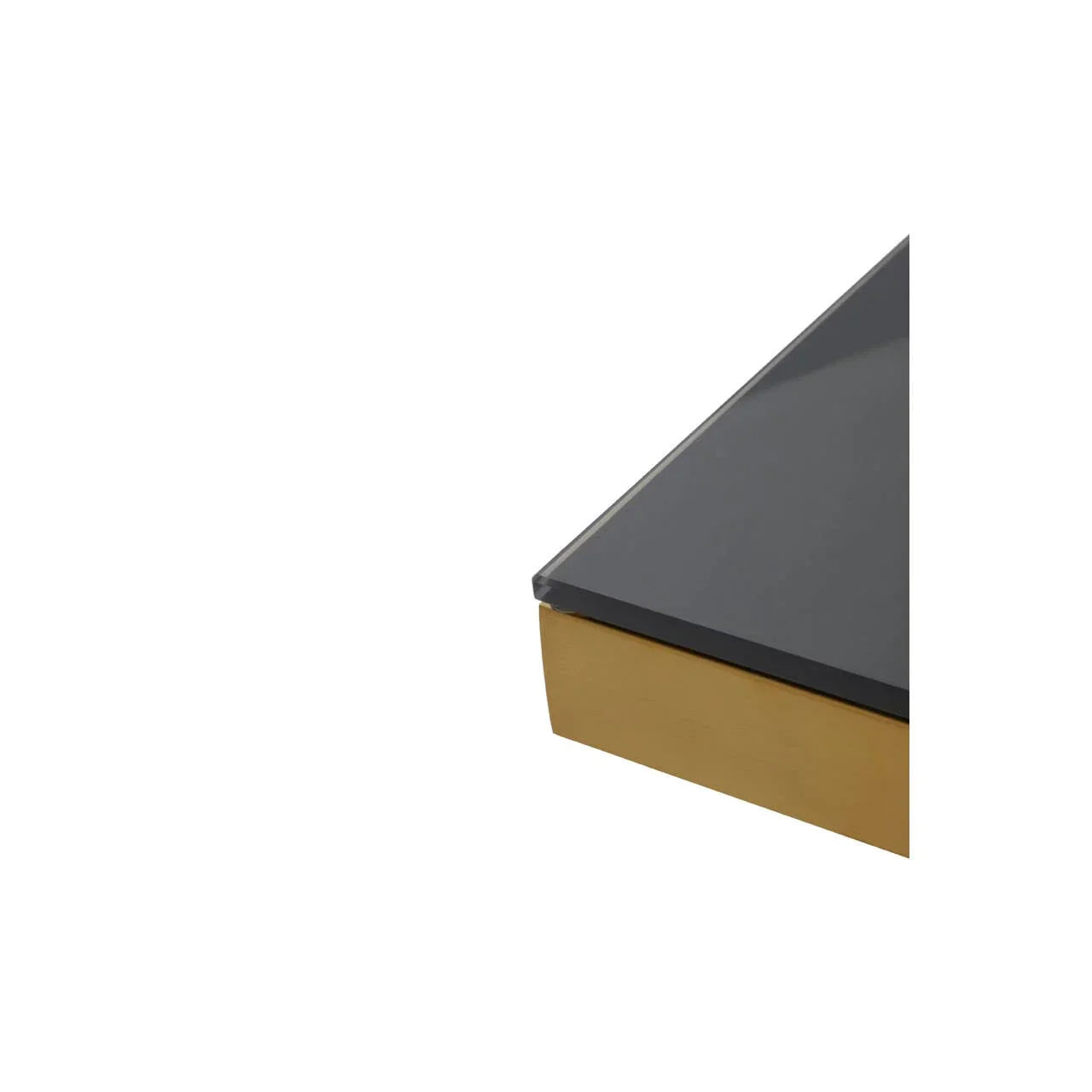 Closeup of glass table top with black finish and gold metal frame corner