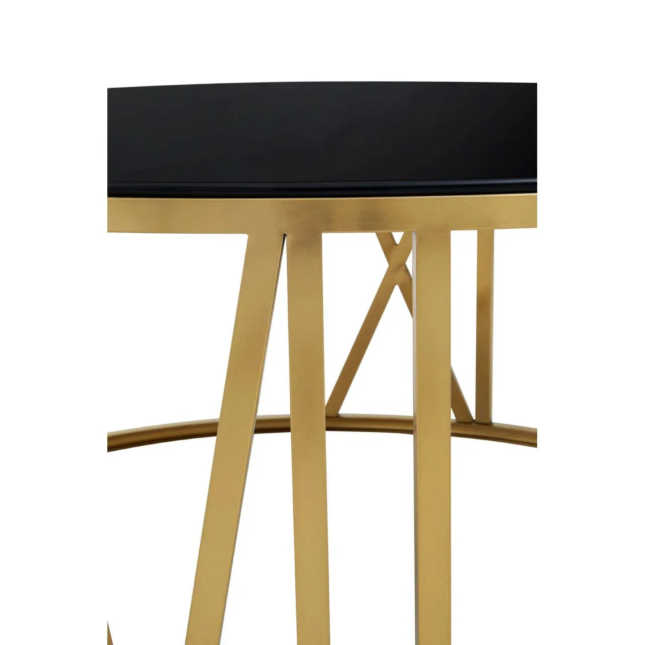 Close view of gold metal frame with black glass table top