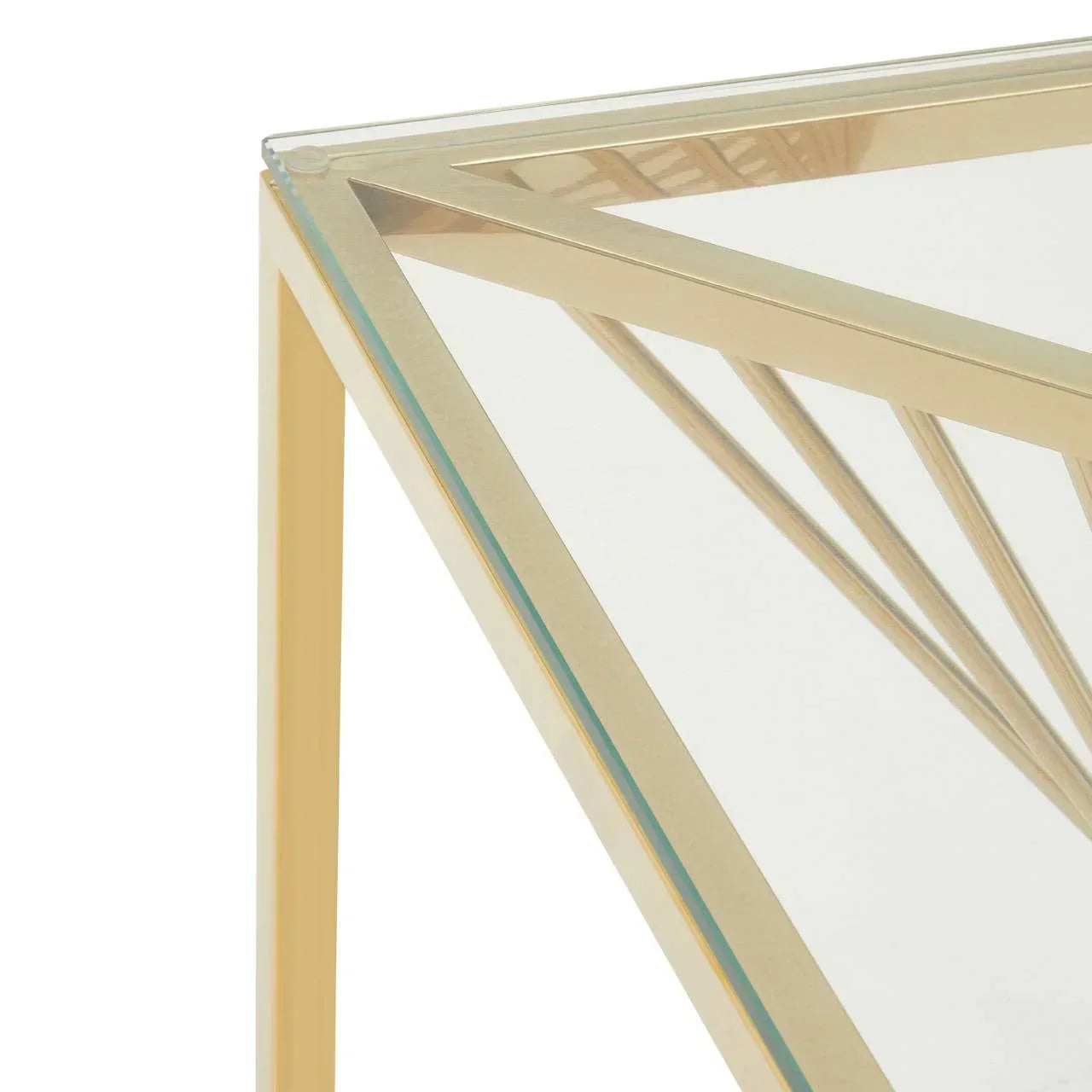 Gold metal and glass coffee table corner with geometric frame detail