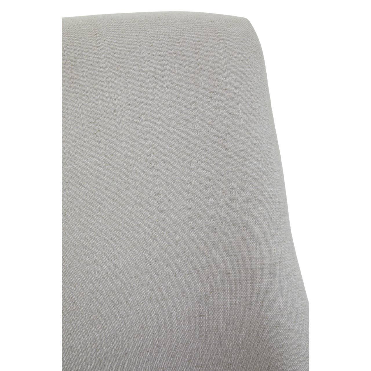 Closeup of light grey fabric upholstered dining chair backrest
