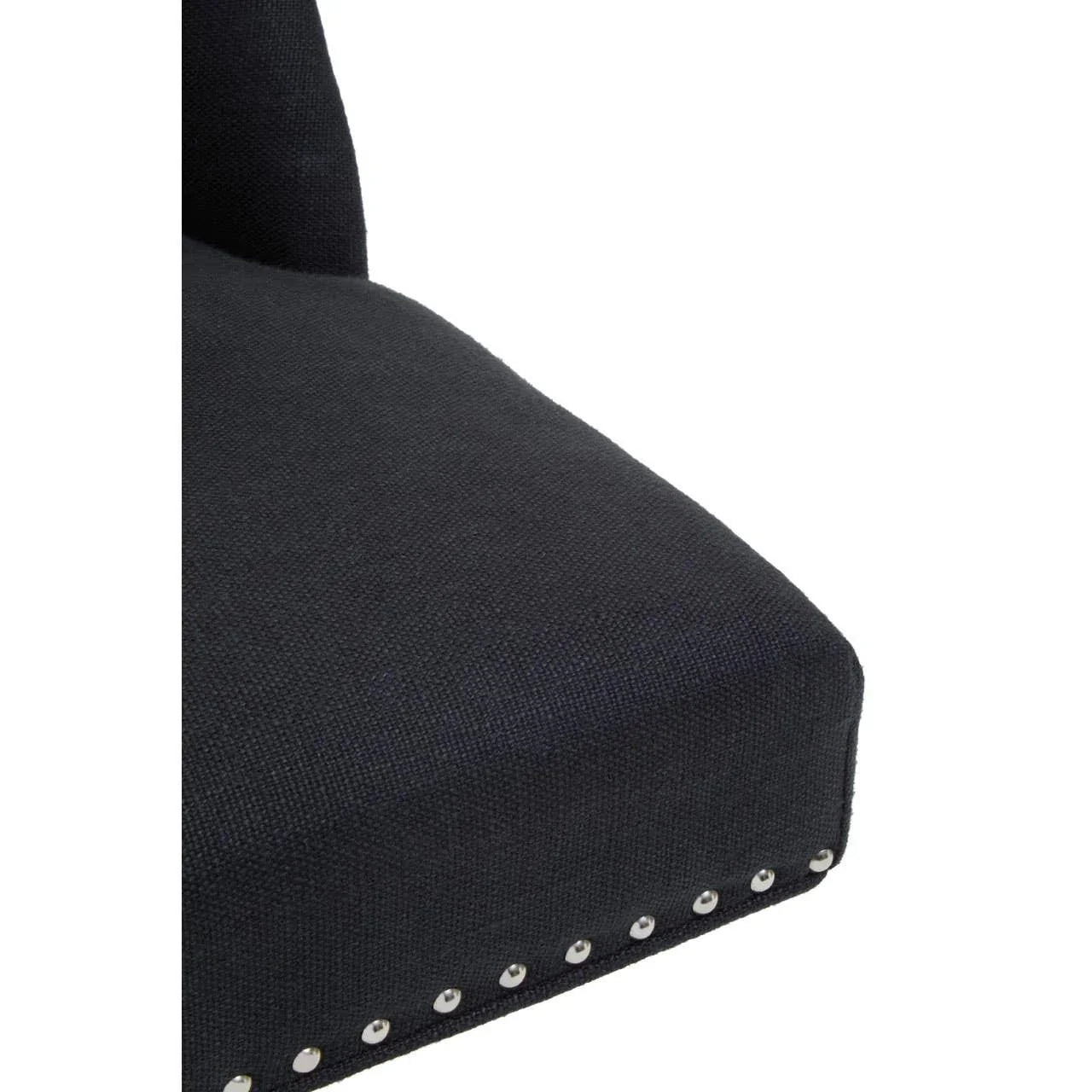 Close-up of black fabric chair seat with silver nailhead trim detail