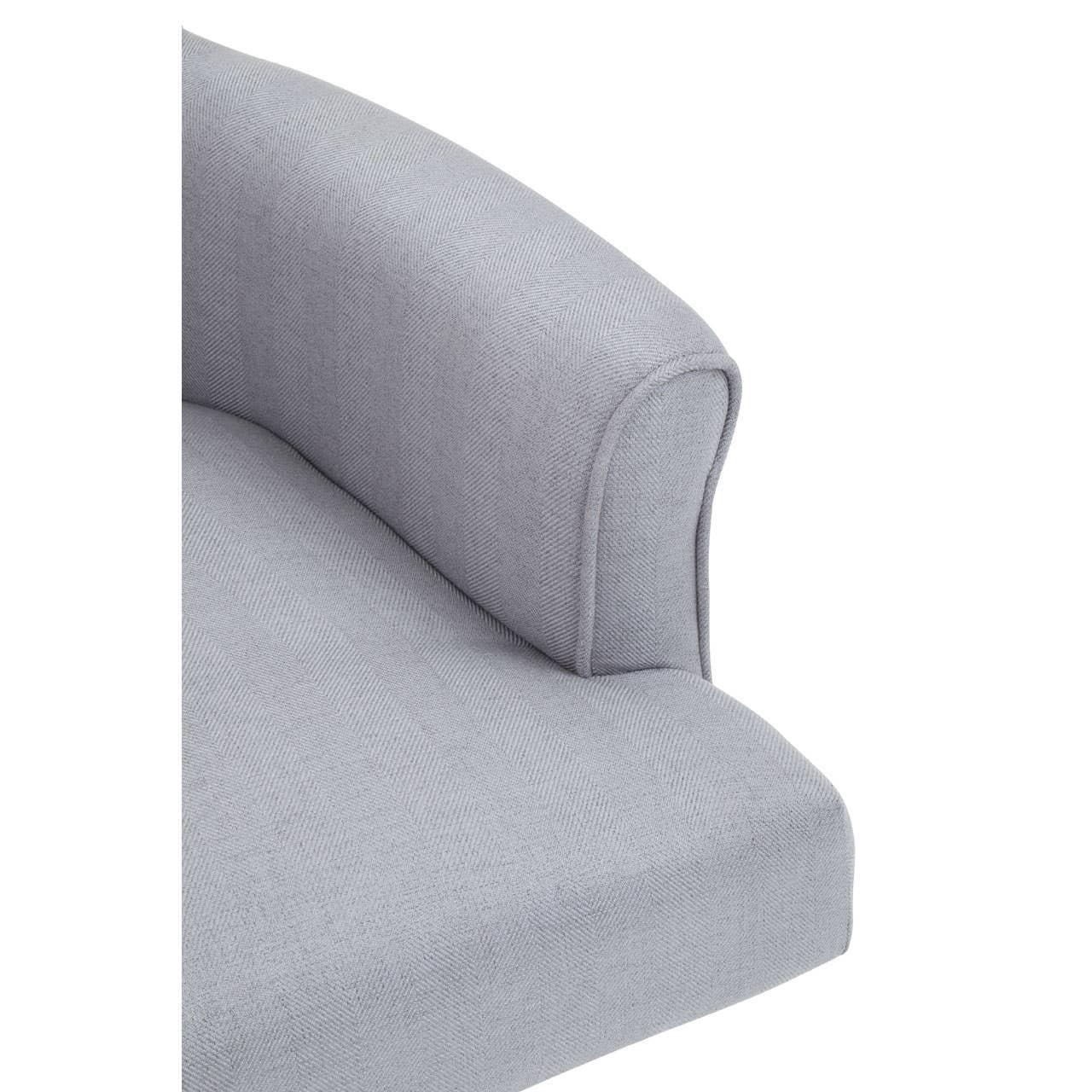 Light grey fabric sofa armrest and seat cushion close-up