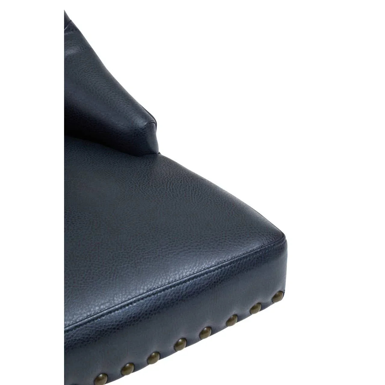 Navy leather sofa seat corner with brass stud detailing and matching cushion