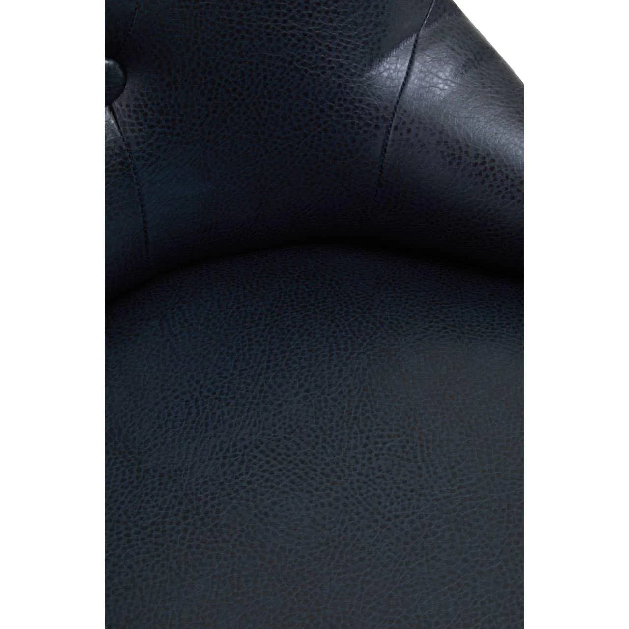 Close-up of dark faux leather armchair upholstery with stitched seam and button detail