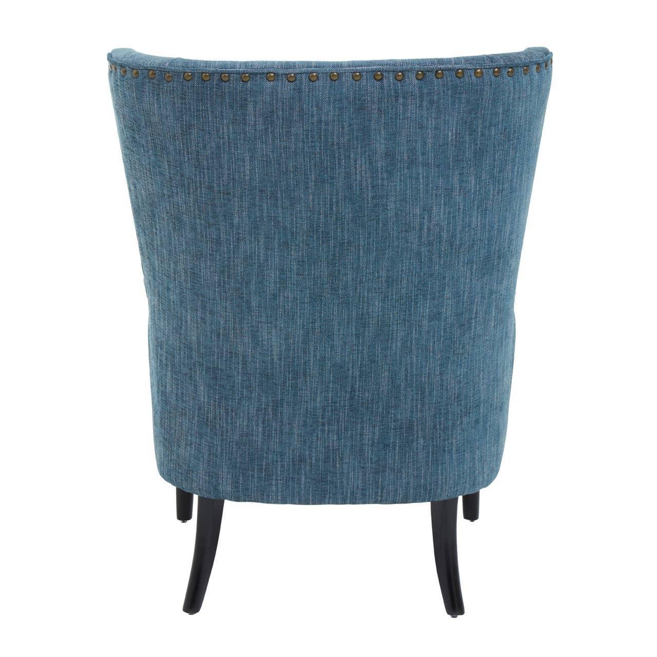 Blue upholstered accent chair rear view with nailhead trim and black wooden legs