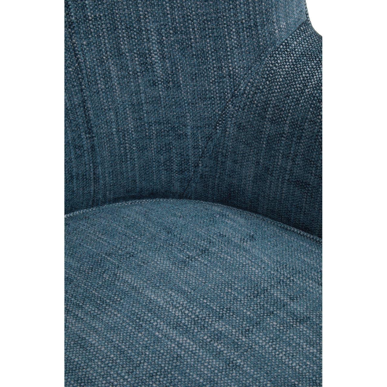 Close up of blue fabric armchair upholstery and stitching detail