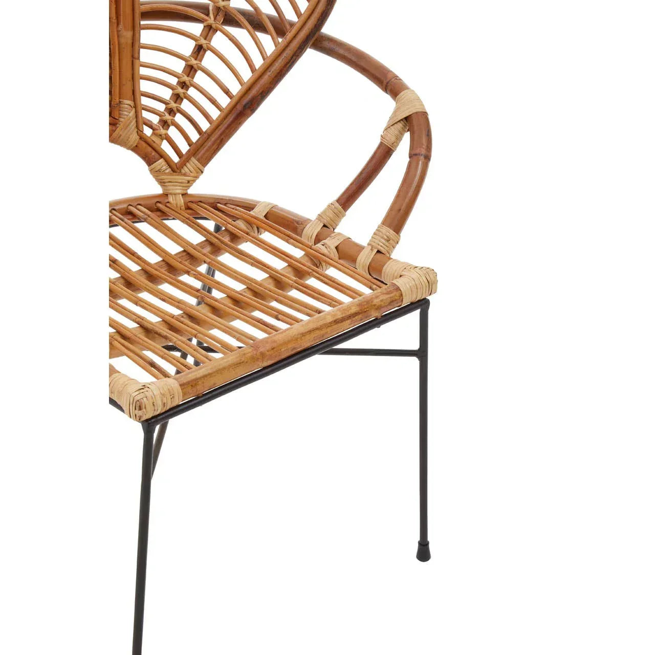Curved rattan dining chair with black metal legs and woven backrest, side angle view