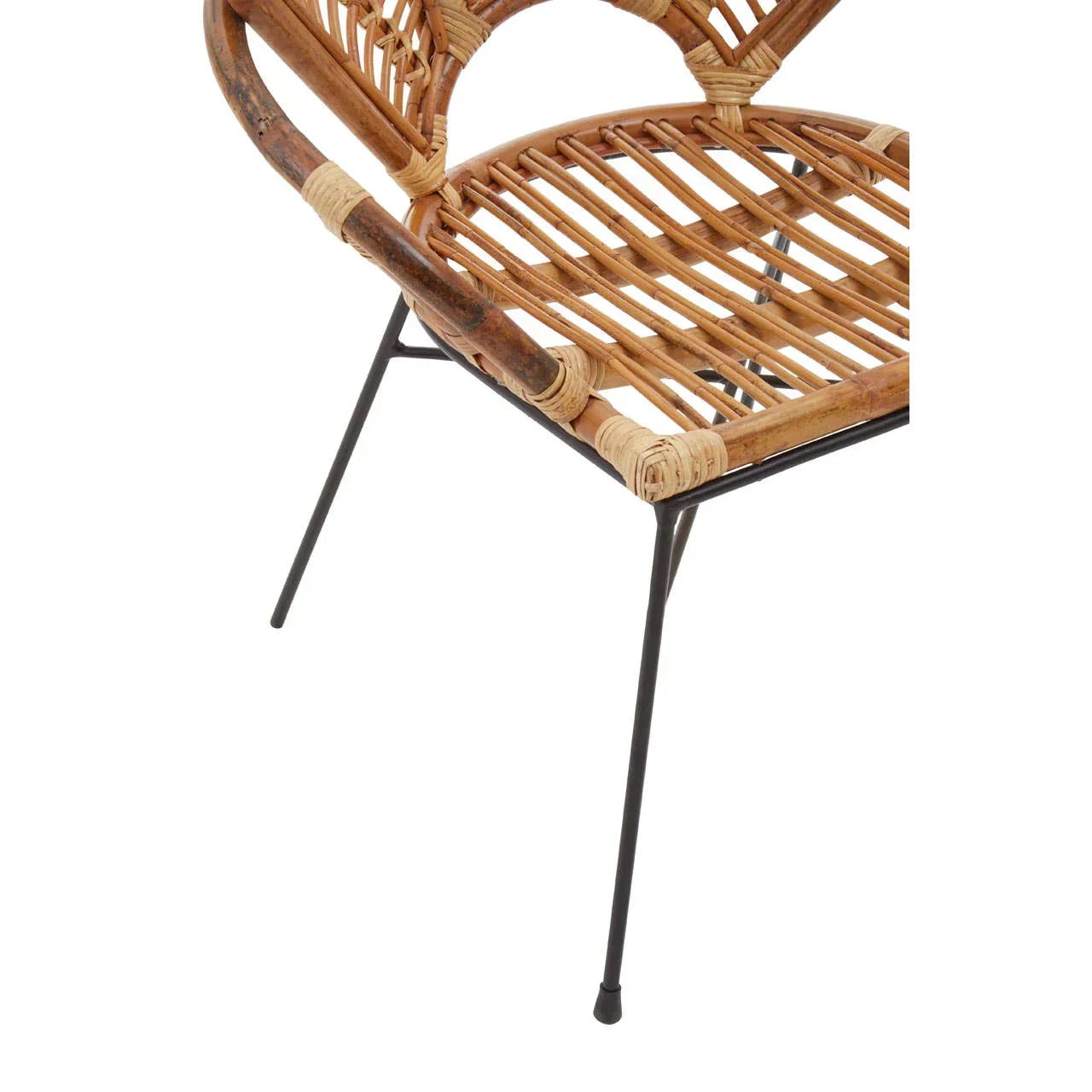 Rattan dining chair seat and backrest with black metal legs, close-up view