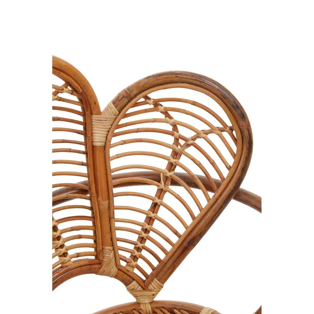 Closeup of natural rattan chair back with curved woven detail
