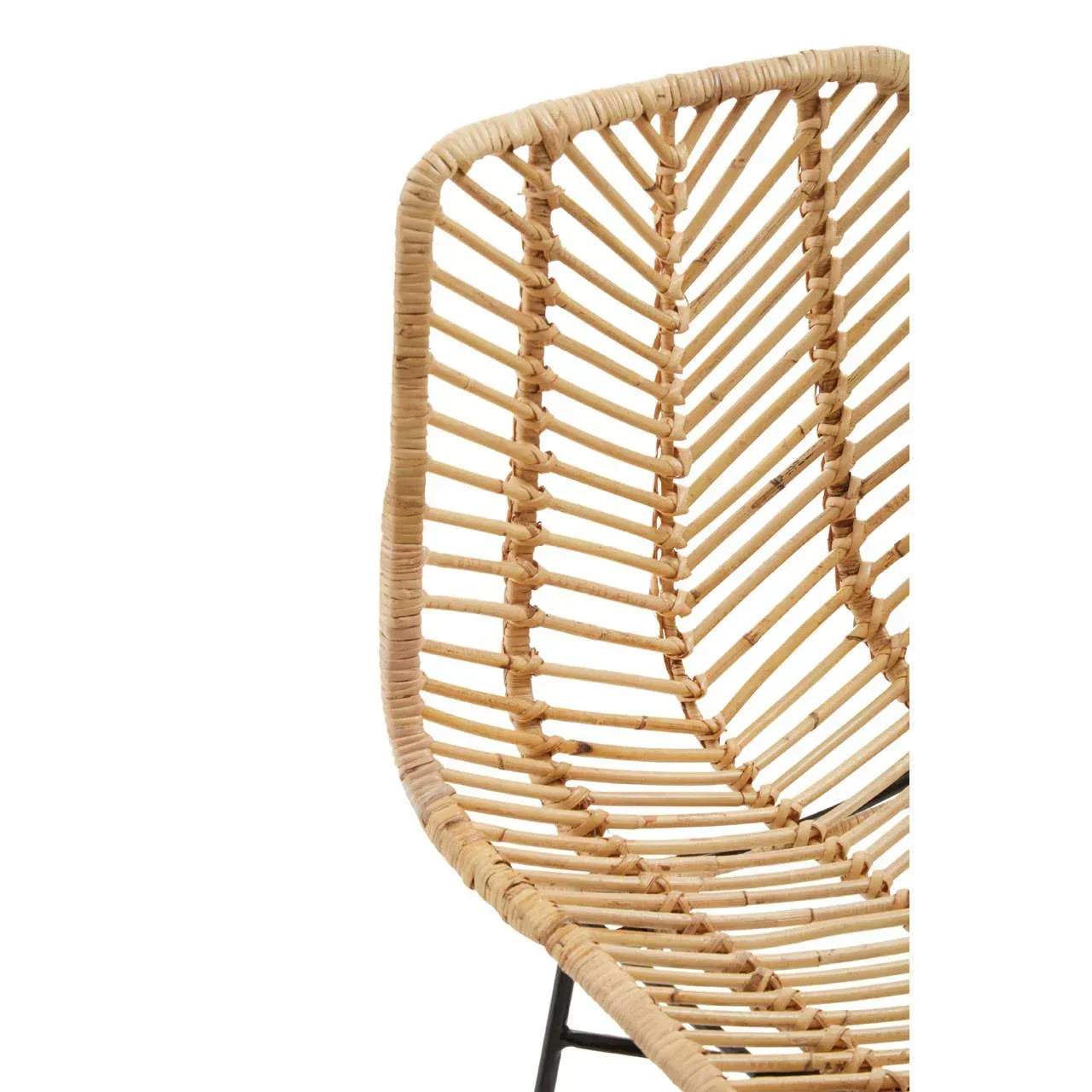 Close up of natural rattan chair seat and curved backrest with woven chevron pattern
