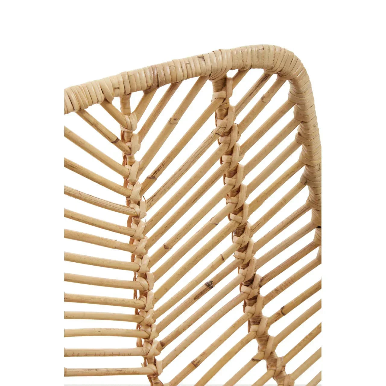 Close up of natural rattan chair backrest with woven vertical slats and rounded top corner